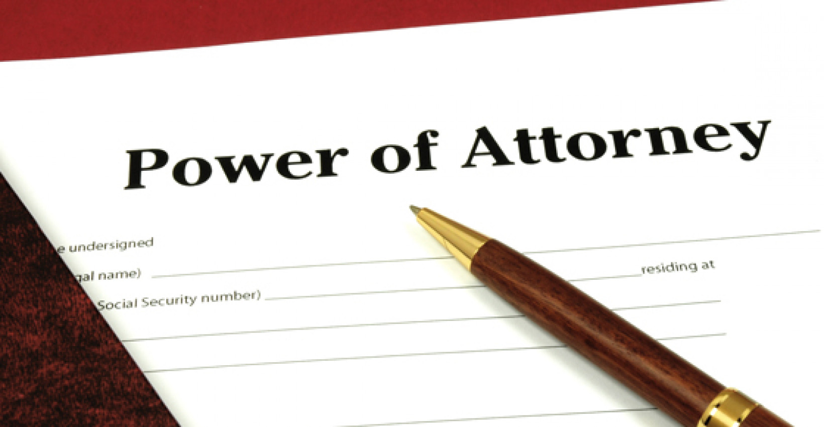 A pen resting on a document called Power of Attorney