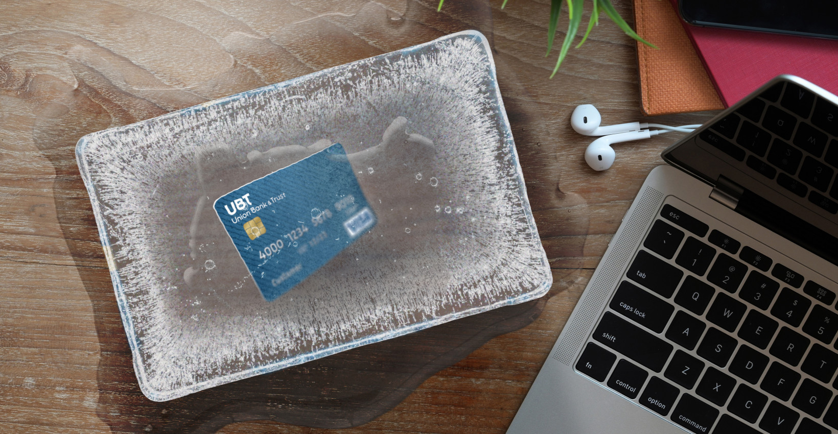 A desktop with a credit card and laptop