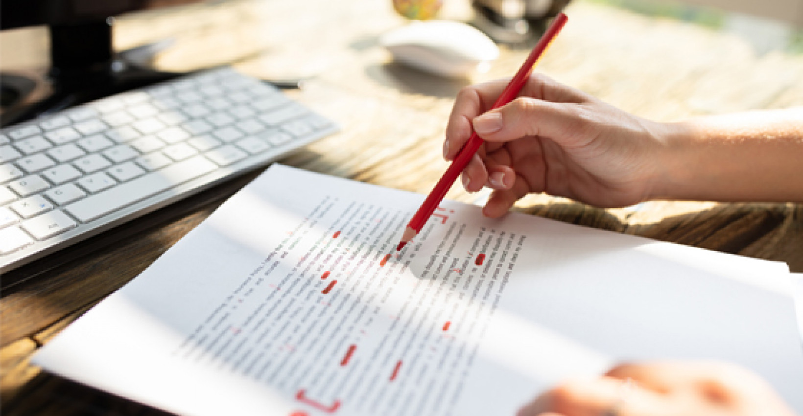 A closeup of a textbook as someone highlights passages