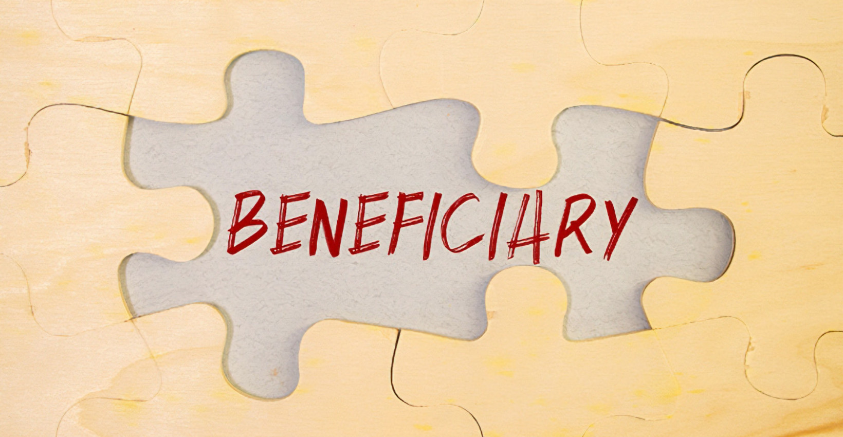 puzzle pieces surround the word beneficiary 