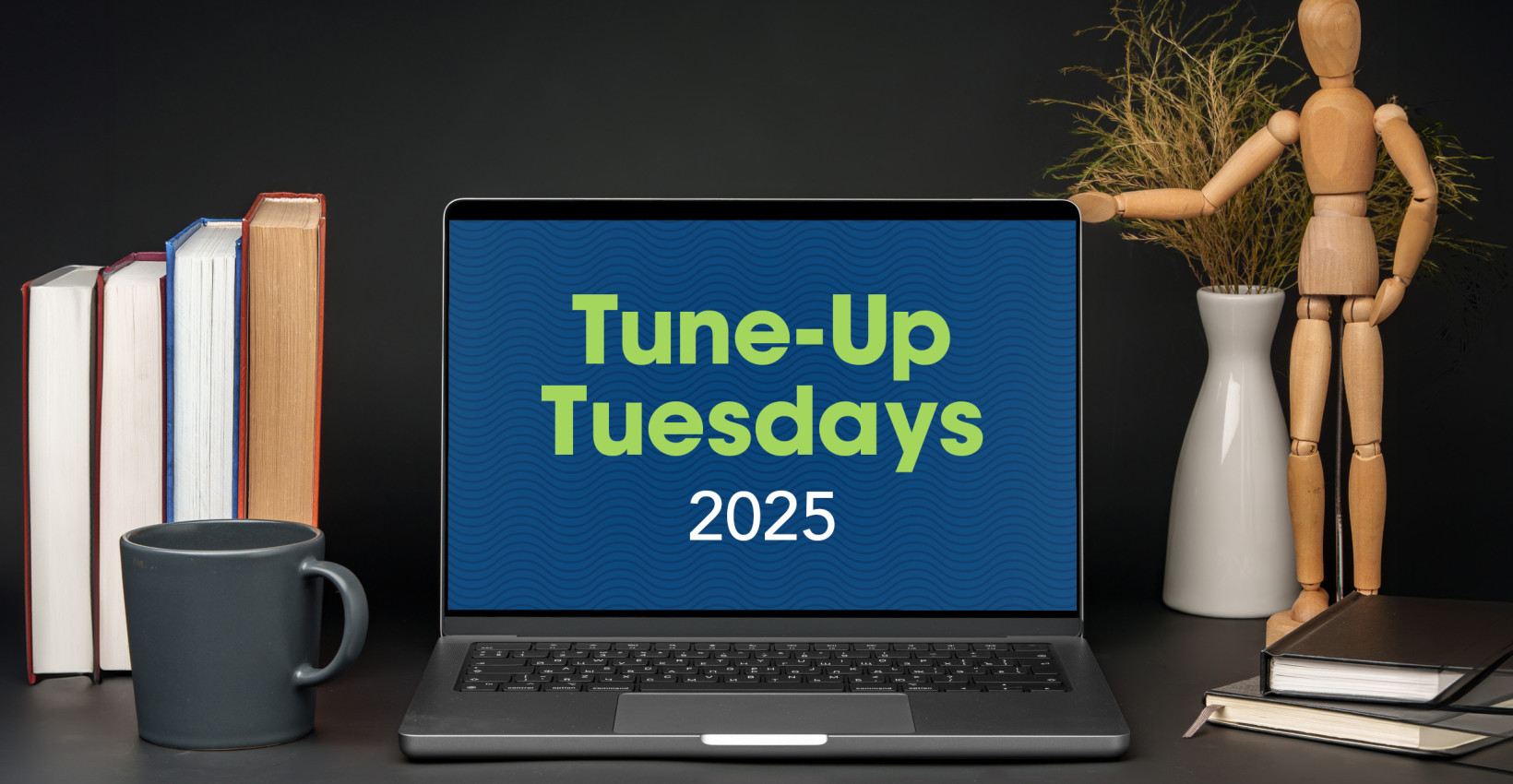 a laptop sits open on a desk and says tune-up tuesdays 2025