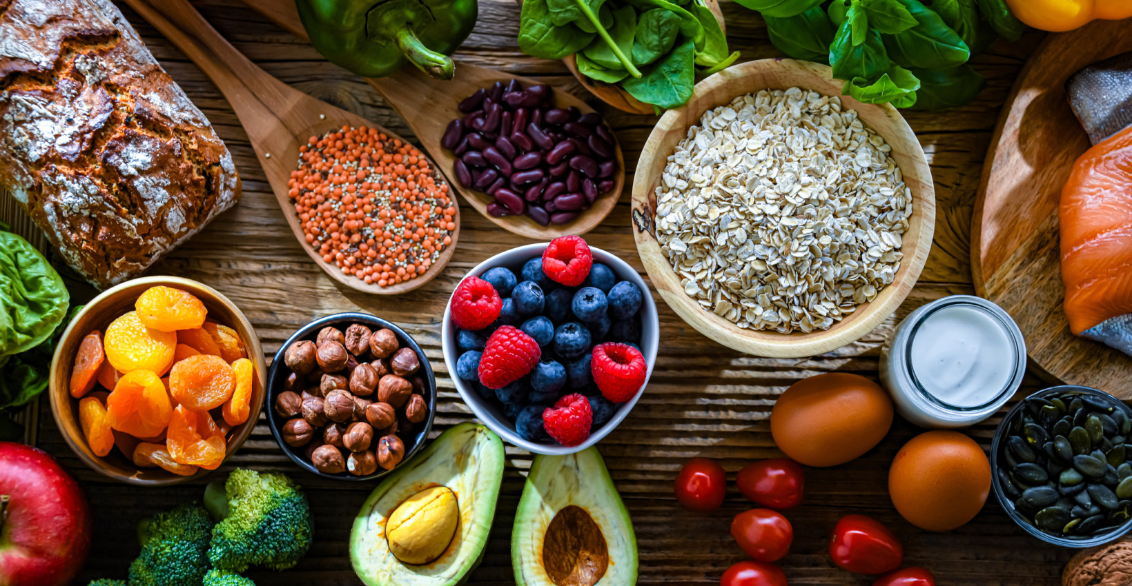 a grouping of vegetables on a cutting board