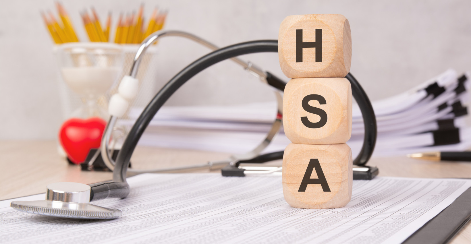 3 wooden blocks stacked on top of each other that say hsa