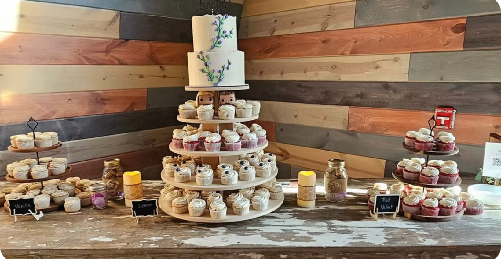 a table displaying cakes and desserts