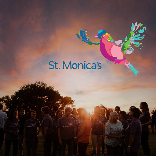 A sunset with the St. Monica's logo
