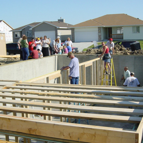UBT employees work on a Habitat For Humanity house