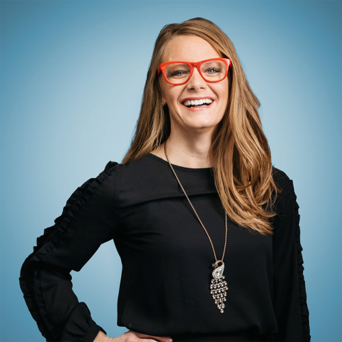 Steph Dinger headshot with blue background