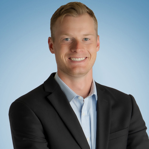 Jack McCool headshot blue background 2025 square