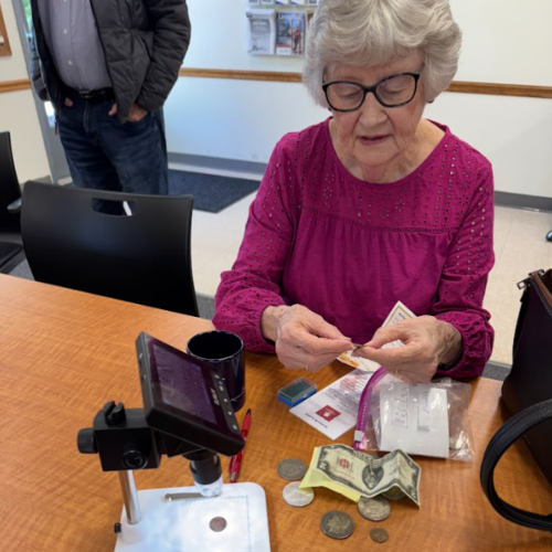 a woman looks at money