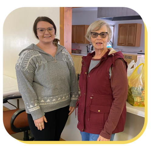 two women smile together