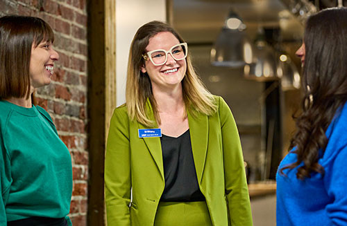 Photo of Bank employee in chartreuse suit