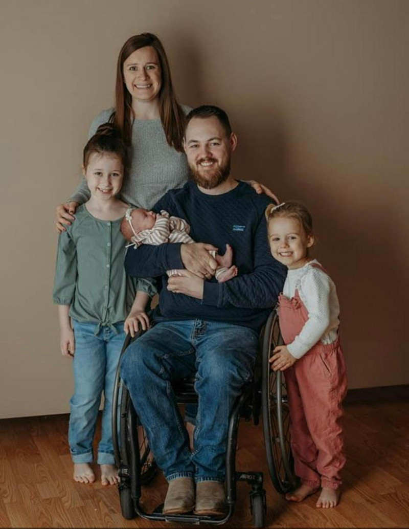 Taylor Graham with is wife, two young daughters, and infant daughter.