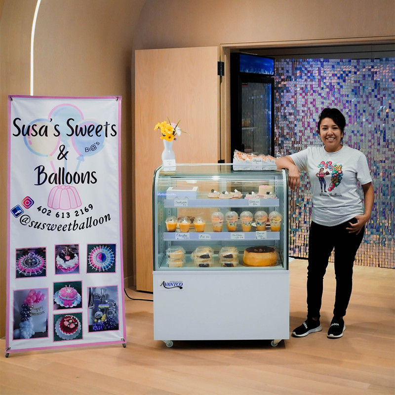 Bia with Susa Sweets standing next to pop-up space at Union Bank Place