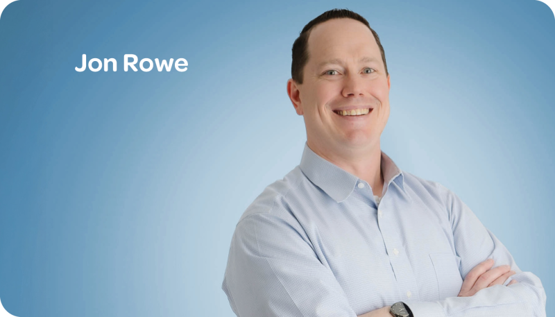 jon rowe headshot blue background