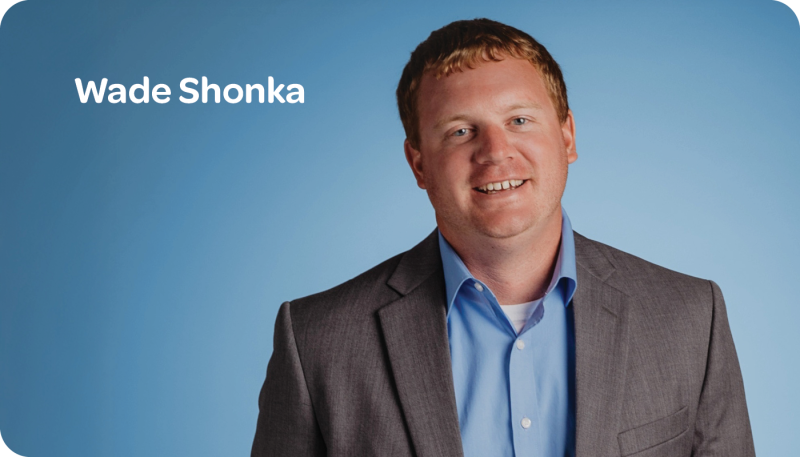 Wade Shonka headshot blue background