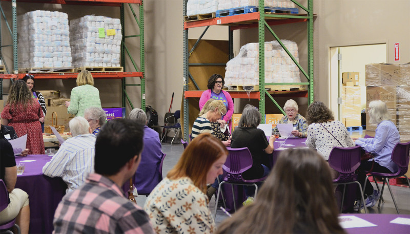 macala carter talks to journey participants in the center for people's food warehouse