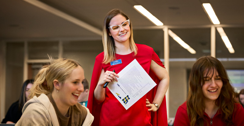 Brittany Planos smiles as she watches students participate in an activity
