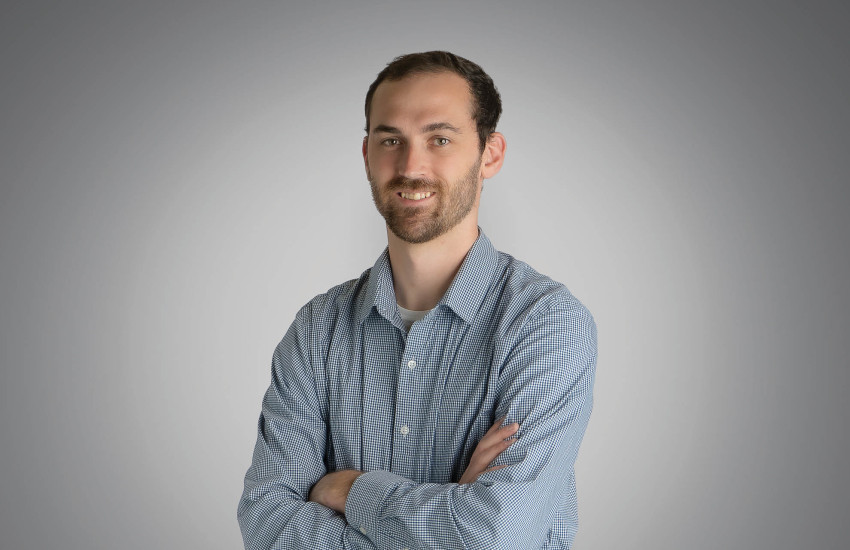 A headshot of Travis Weyers