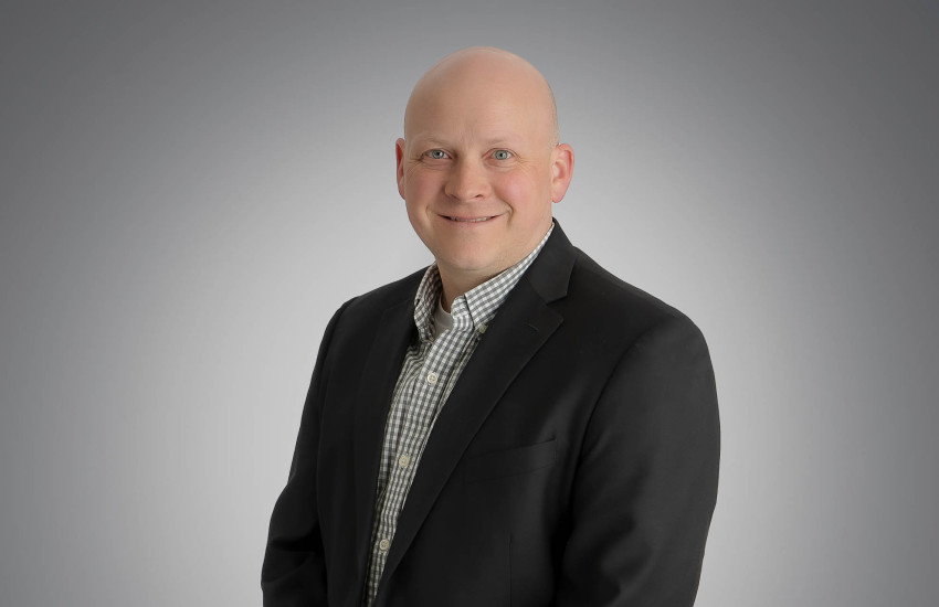 A headshot of Erik Wiedel