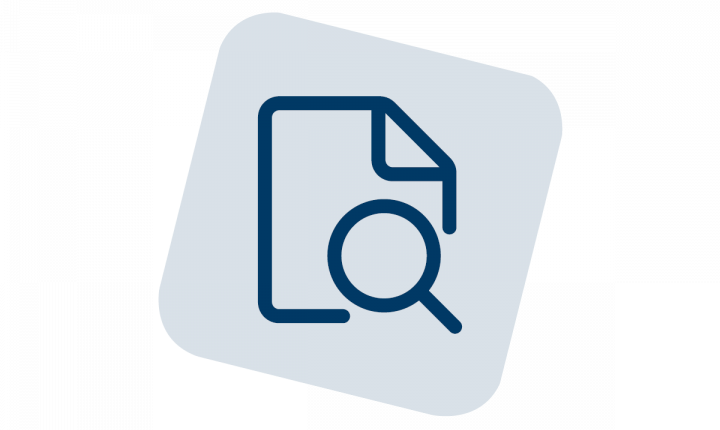 An illustration of a magnifying glass over a sheet of paper