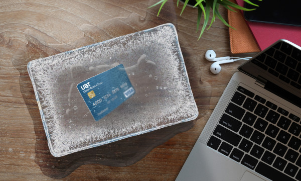 A desktop with a credit card and laptop