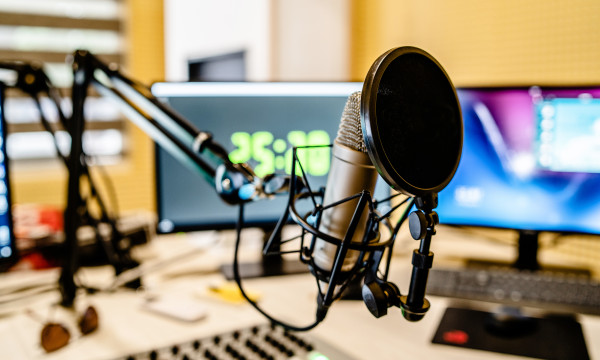 A podcast microphone in a studio