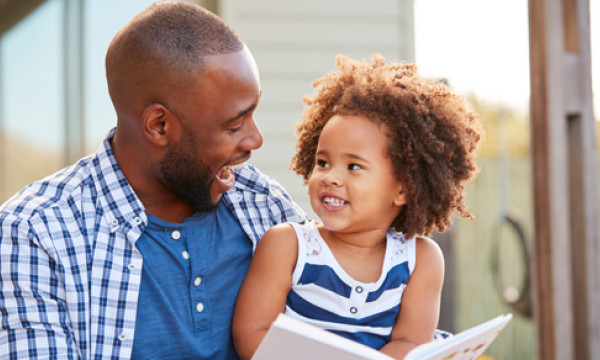 father and daughter smile together