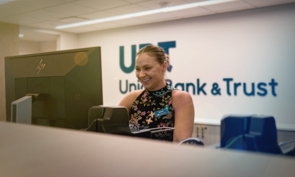 Union Bank Place Branch Manager Marta smiles at her computer