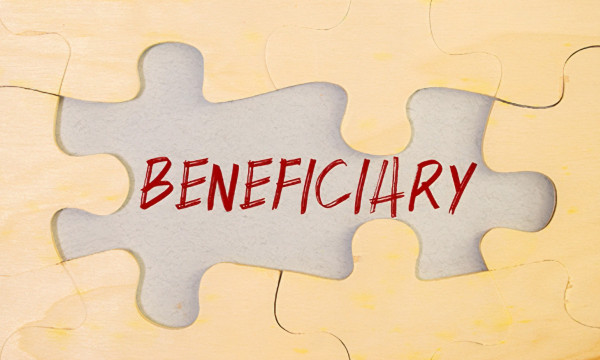 puzzle pieces surround the word beneficiary 