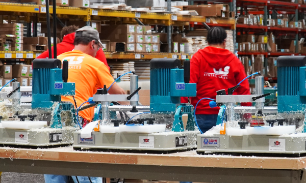 three people work inside central lumber sales