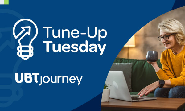 graphic for tune up tuesday includes a woman sitting at her coffee table with a laptop